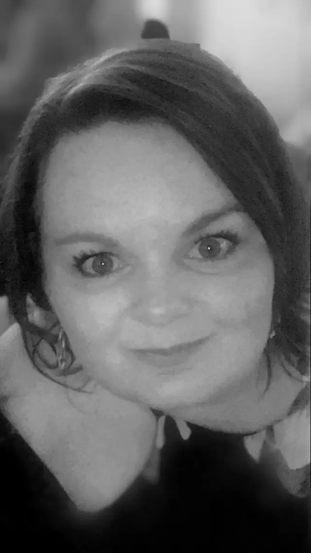 Black and white photo of Lisa looking up at the camer